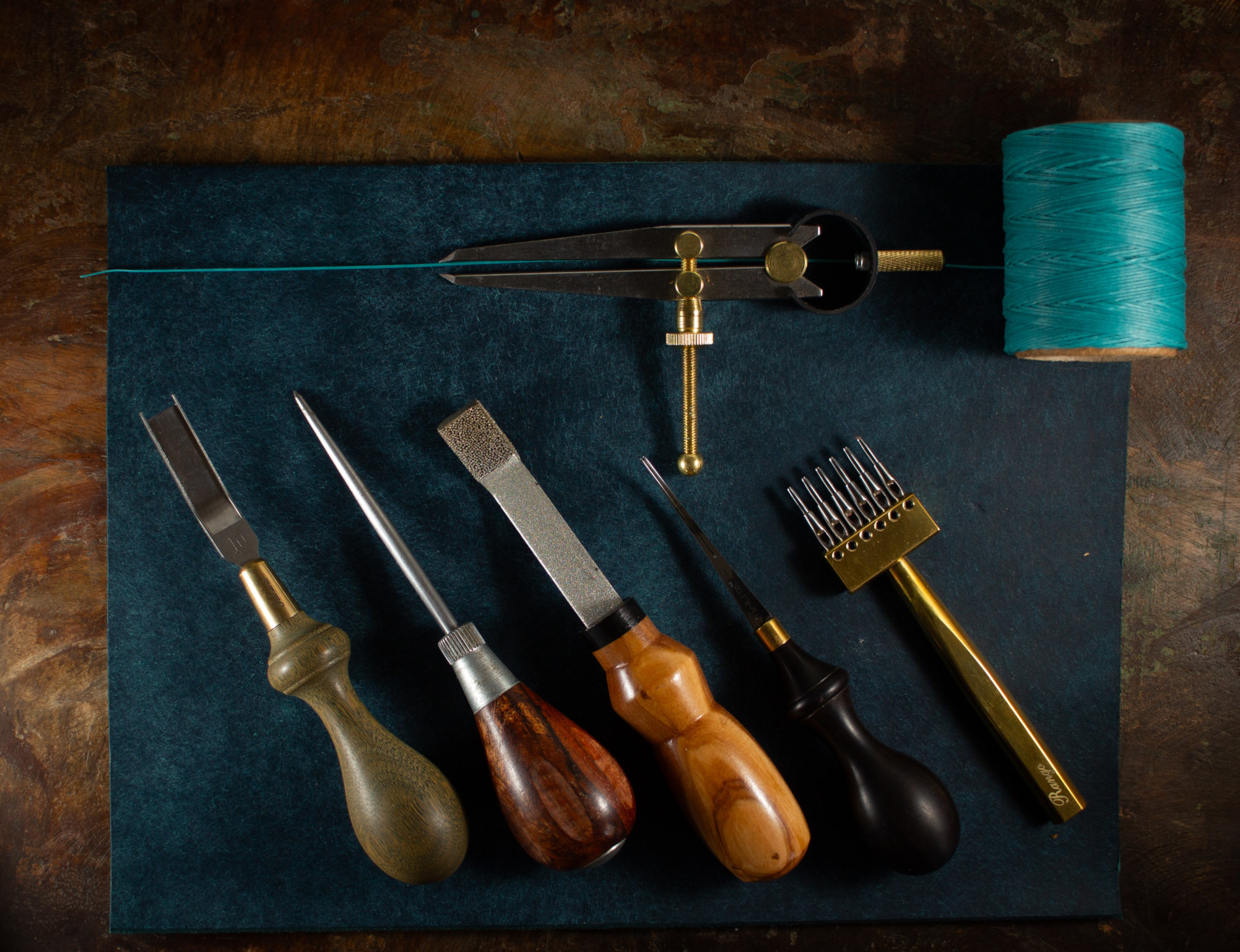 Jamestown Goods, Handmade leather goods tools, thread and leather on display.